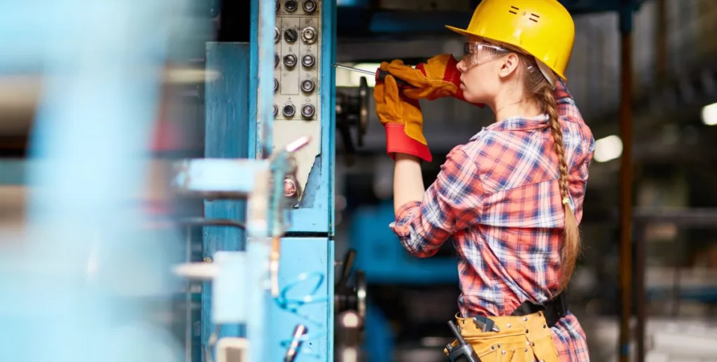 Electrician advertising: female electrician with hard hat and gloves