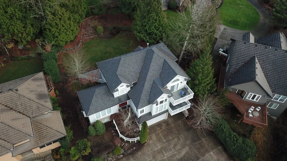 Birds eye view picture of house roofing from drone