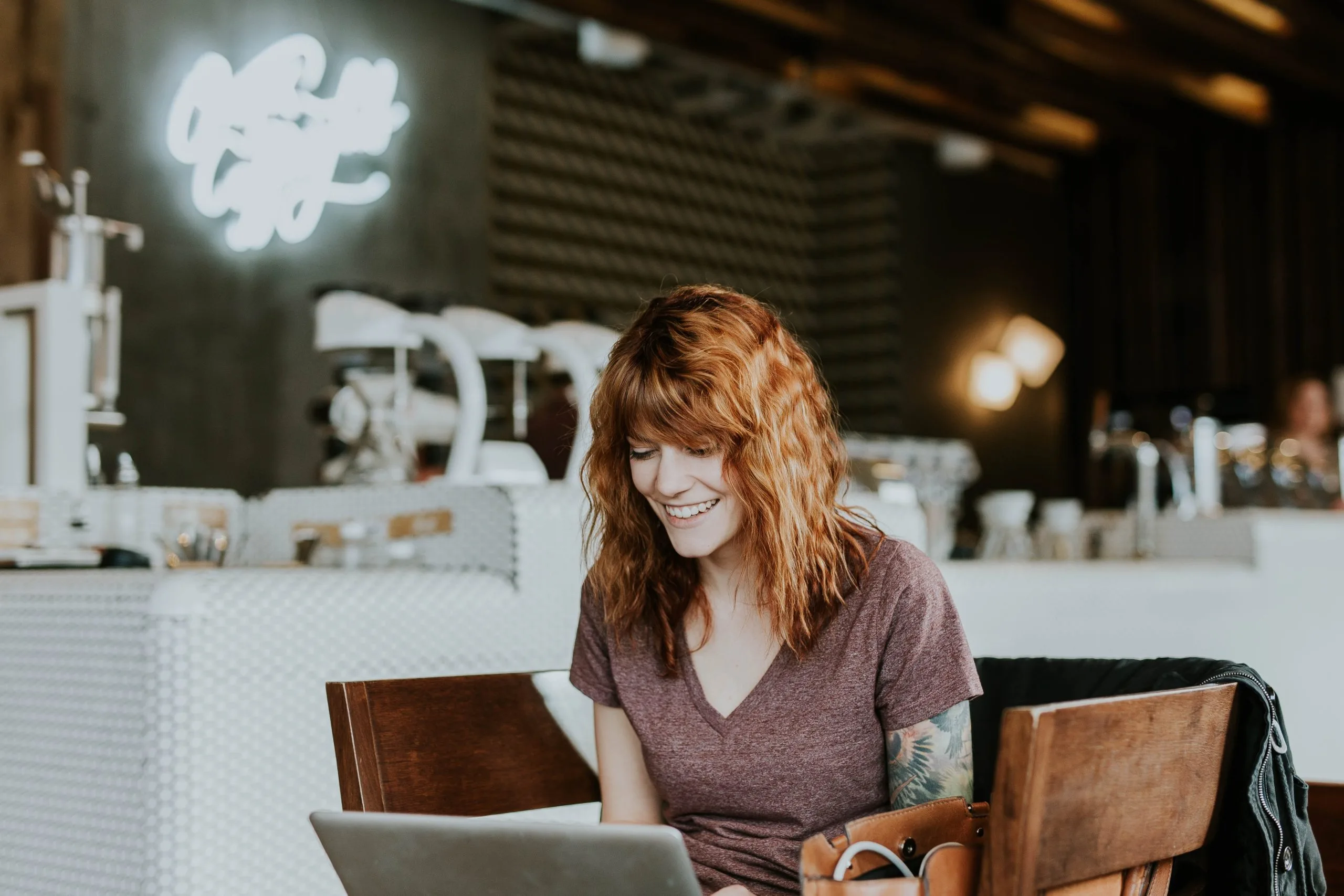 Woman on computer in cafe