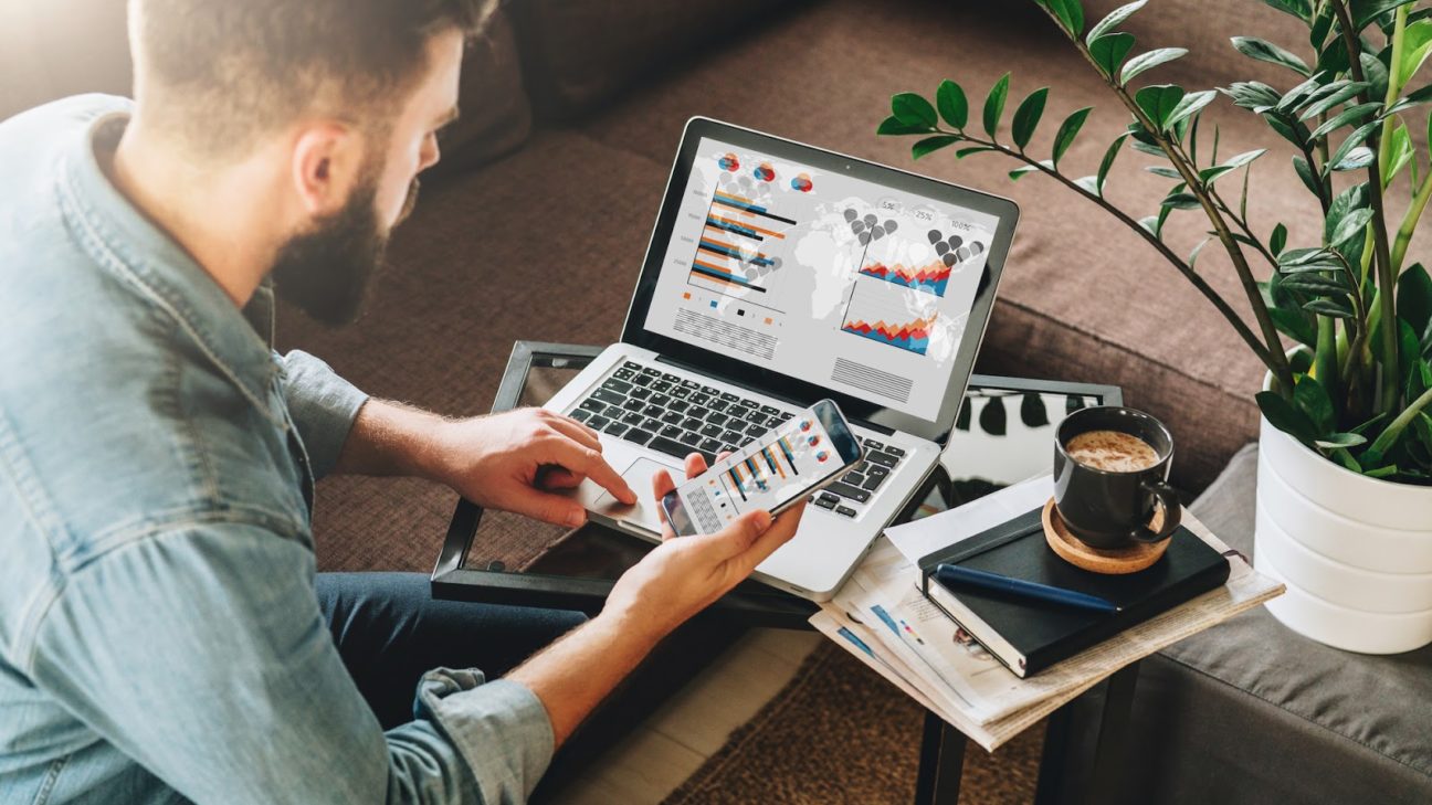 Online marketing for small business: Man multitasking at desk