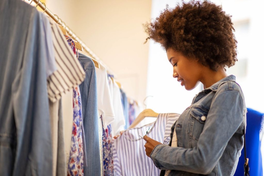 Types of pricing strategies: Woman shopping for clothes 