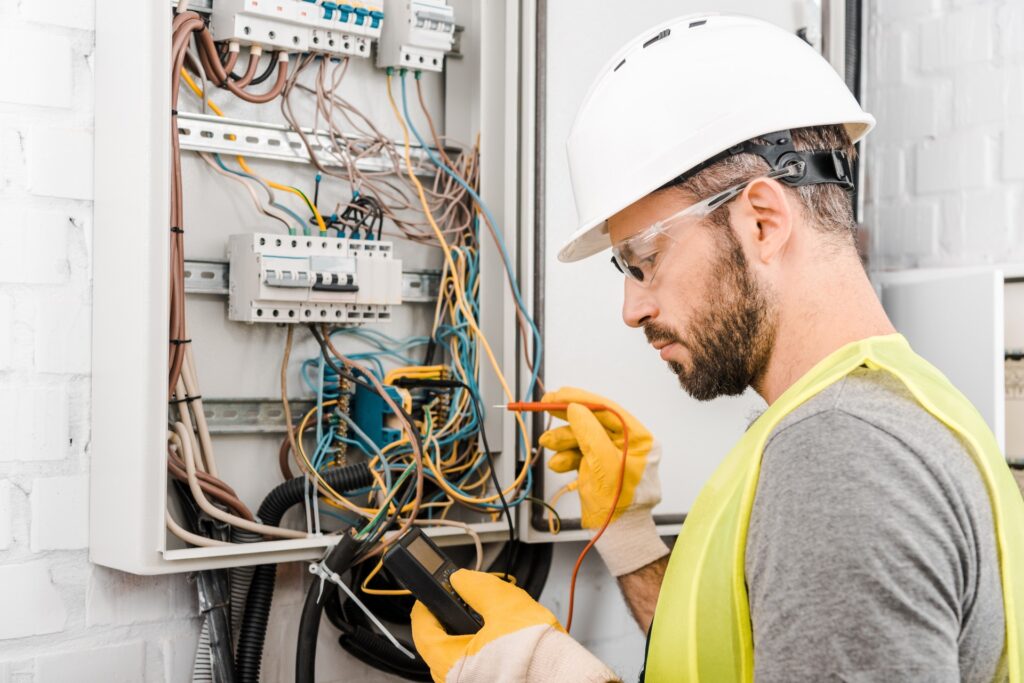 Electrician working on a fuse box