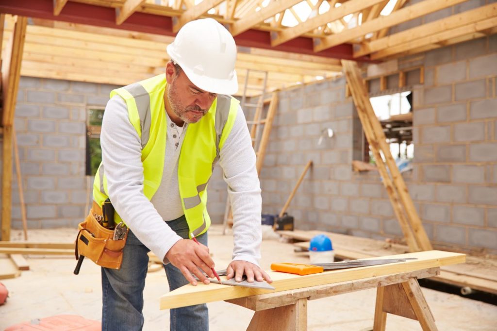 Construction worker wearing helmet at a job site