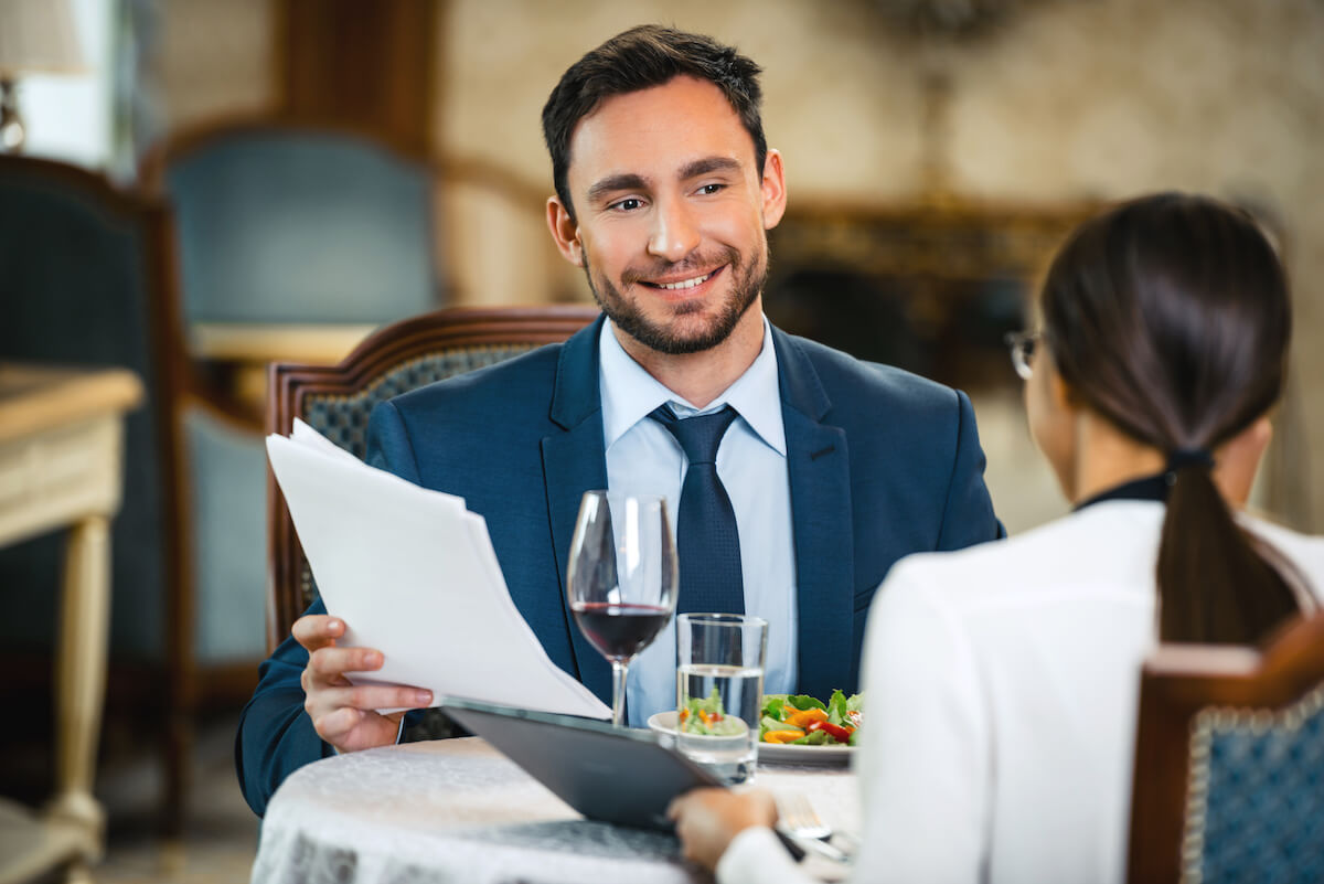 Two people in a dinner business meeting