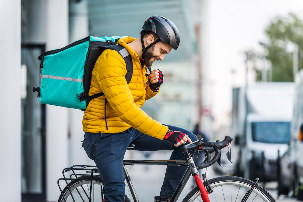 Third-party delivery services: food delivery rider on his bike