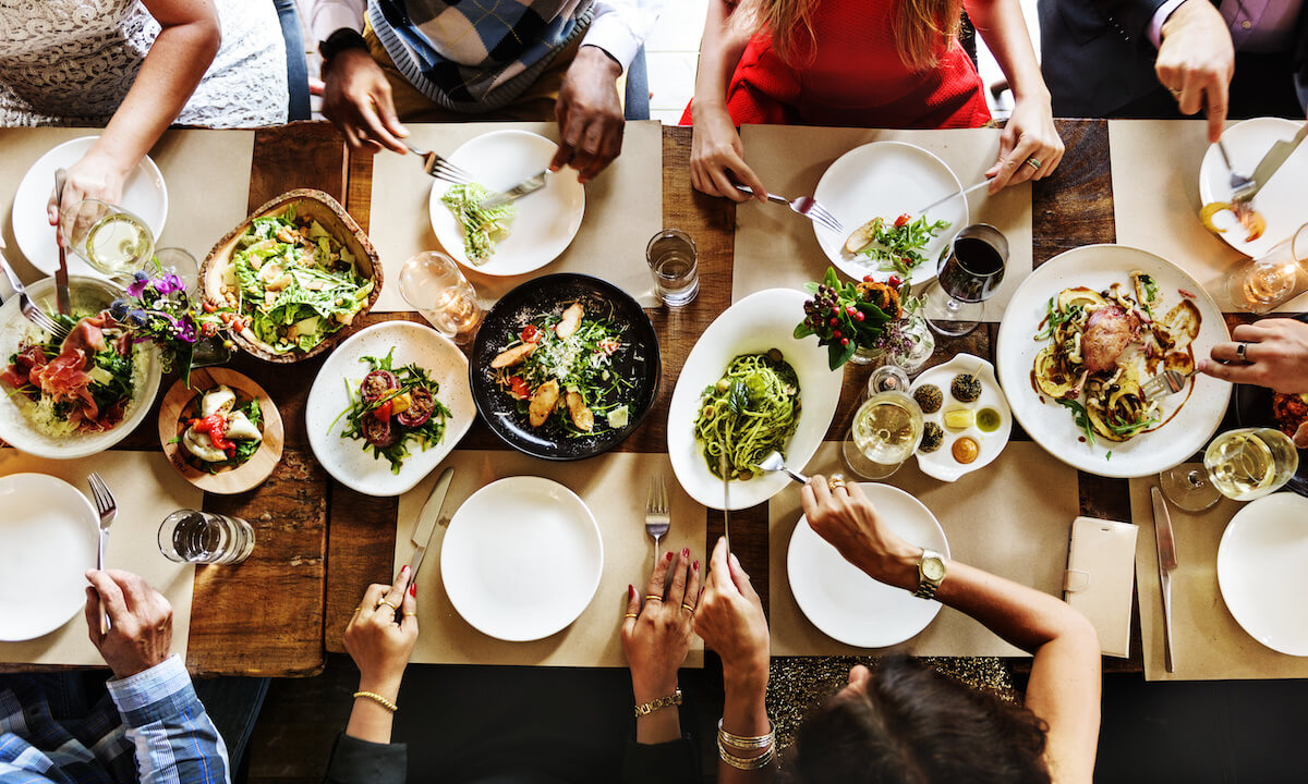 Top shot of a group of people eating at a restaurant