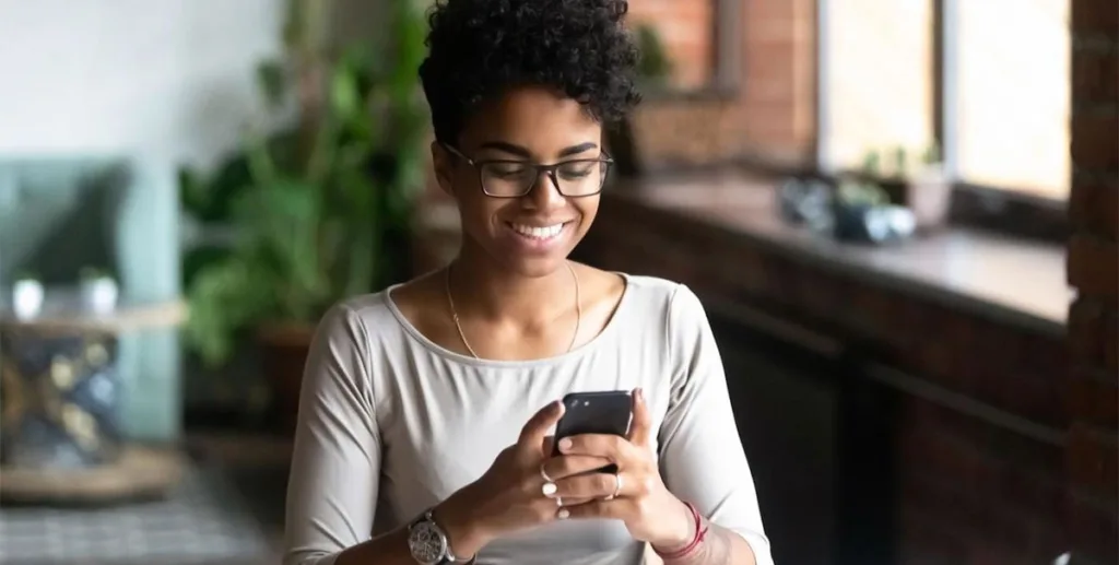 Why is social media important: woman using her phone