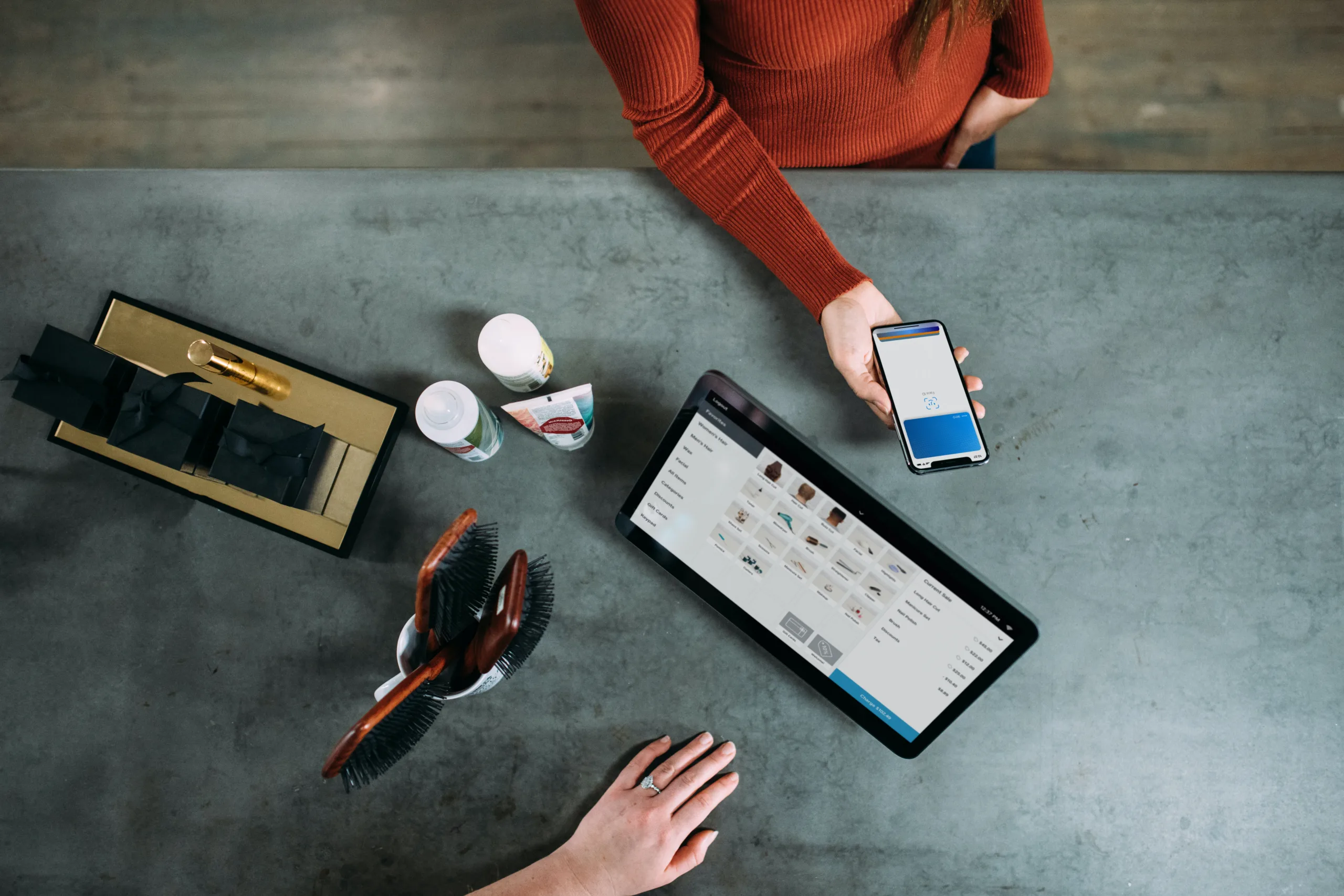 Person using phone for contactless payment to purchase something