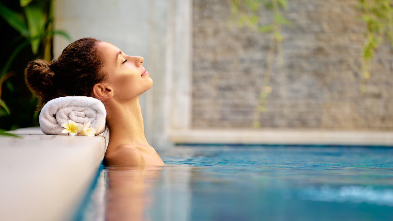 Spa marketing ideas: woman relaxing in a pool
