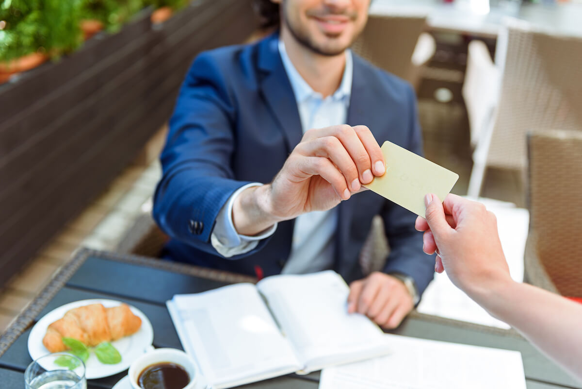 Restaurant Promotion Ideas for Fall: customer paying using his card