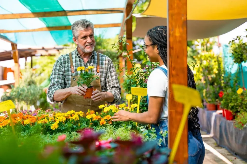 Flower shop owner talking to a customer