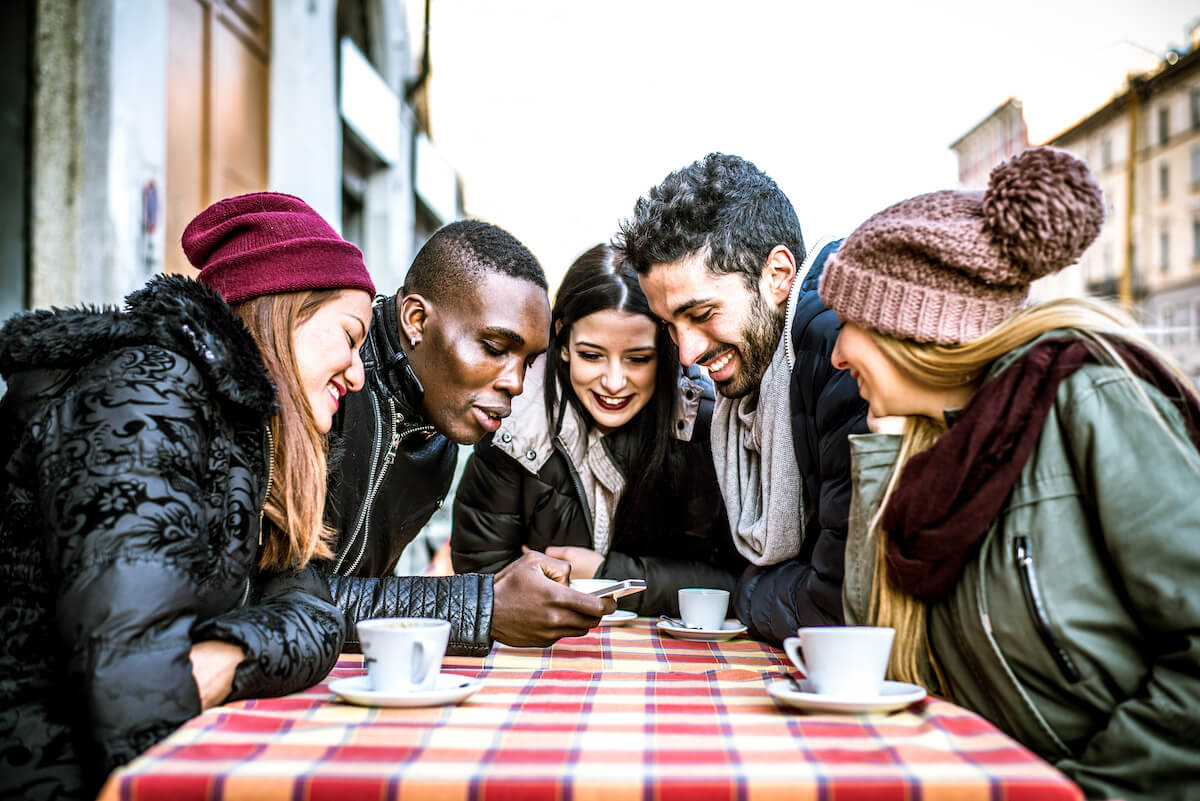 Group of friends watching something on a phone