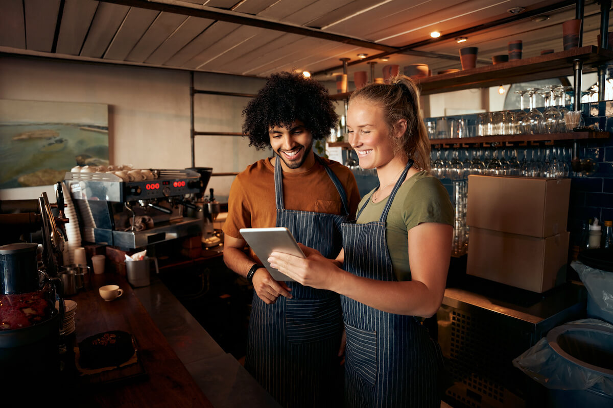 Baristas using a tablet
