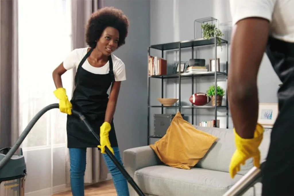 Cleaners using vacuums to clean the floor