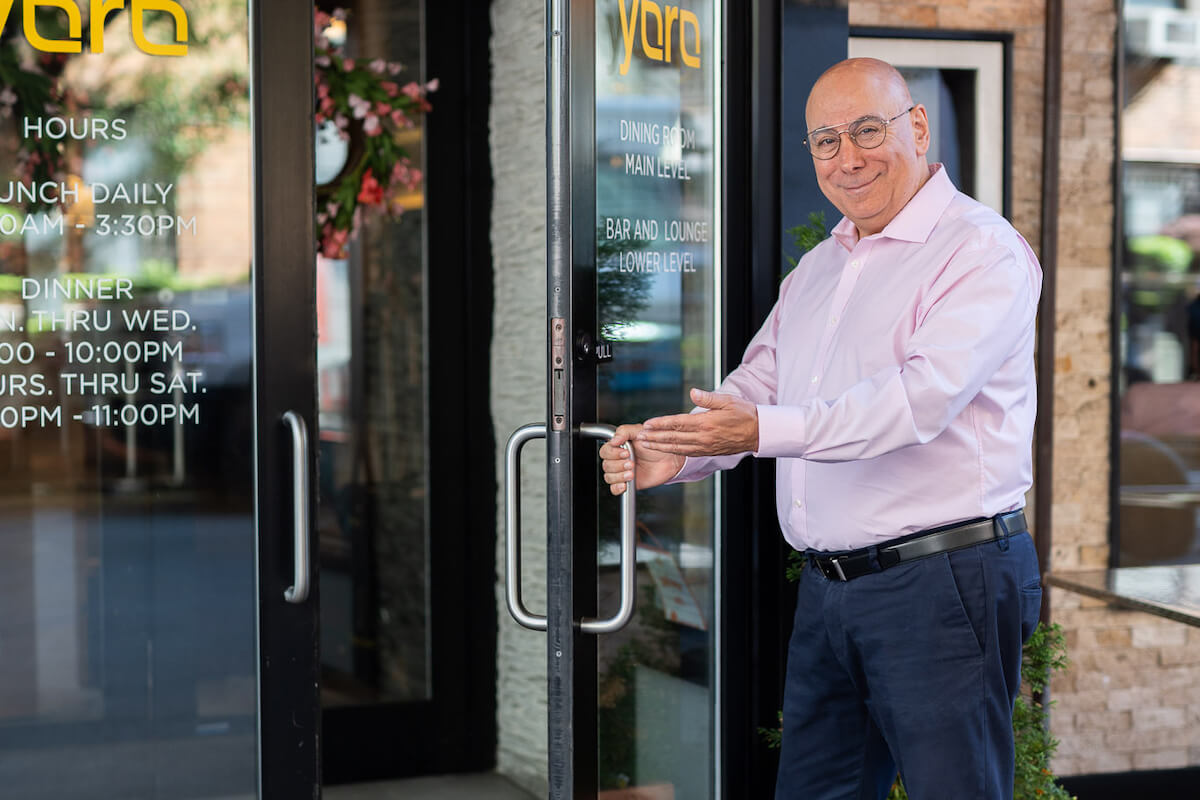 Manager opening a door