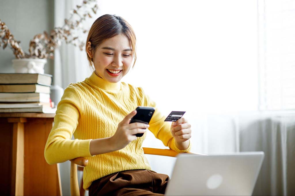 https://business.yelp.com/wp-content/uploads/2023/02/Woman-using-her-cellphone-for-online-shopping.jpg