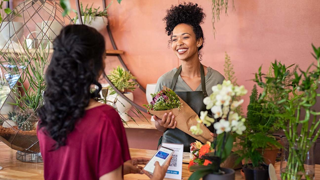 https://business.yelp.com/wp-content/uploads/2023/02/florist-serving-customer.jpg