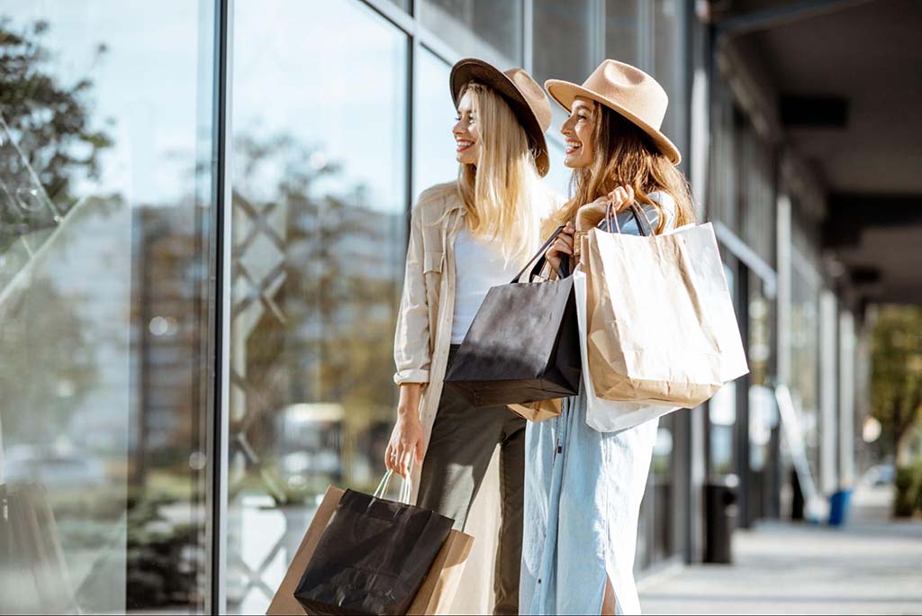 two young women window shopping