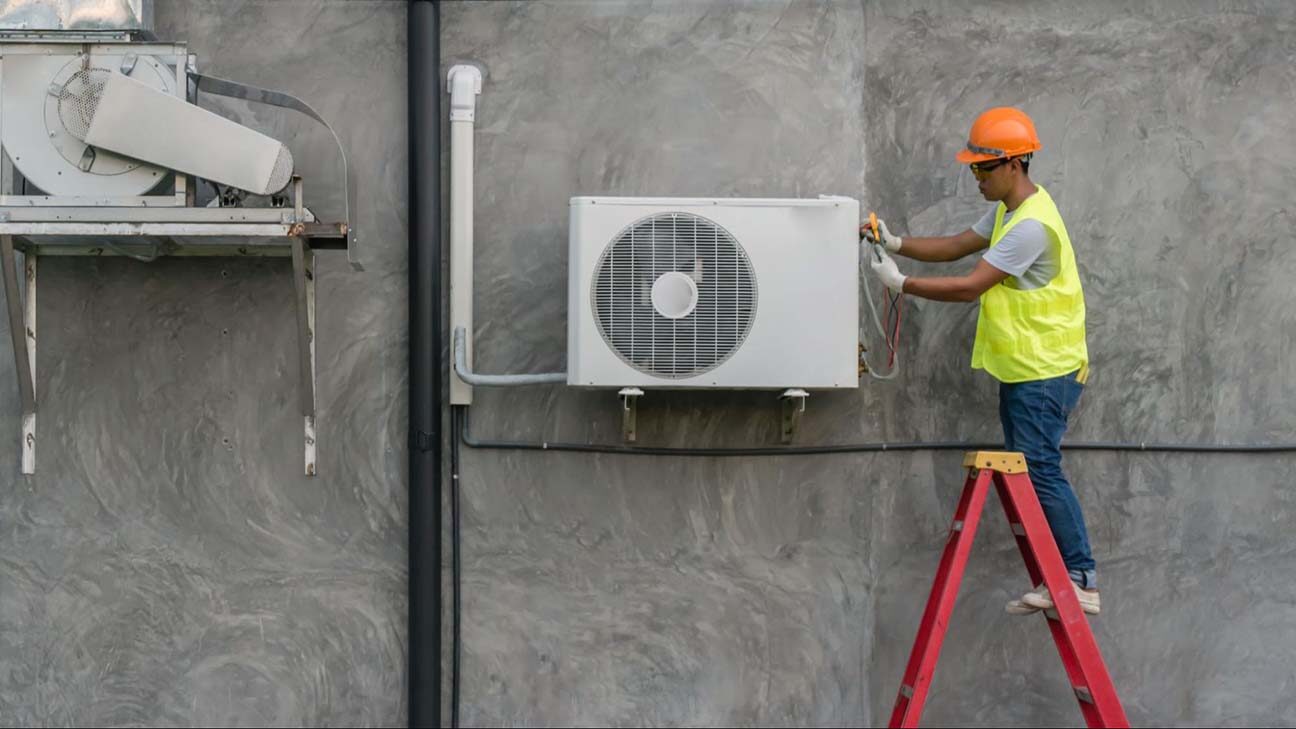 HVAC advertising ideas: worker fixing air conditioning unit