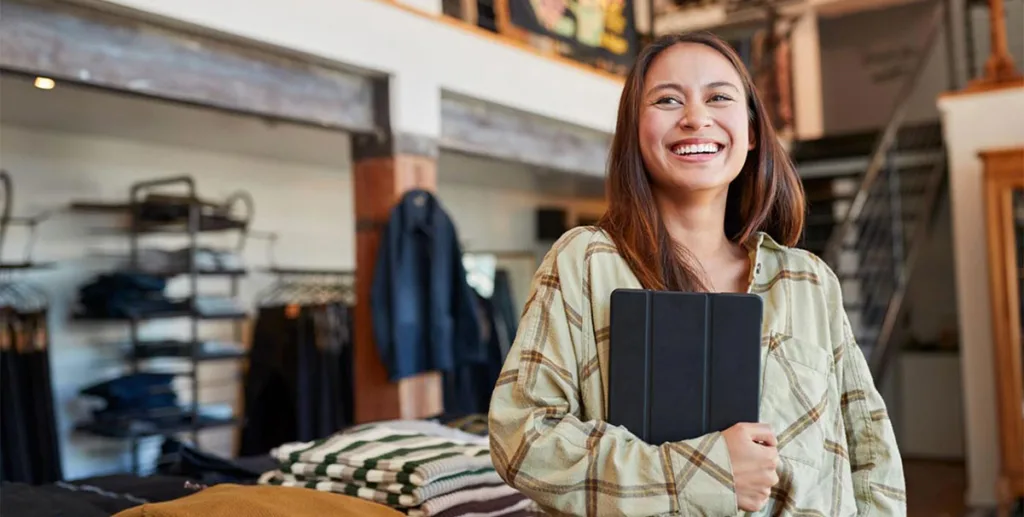 Business advertising: a business owner holding an ipad