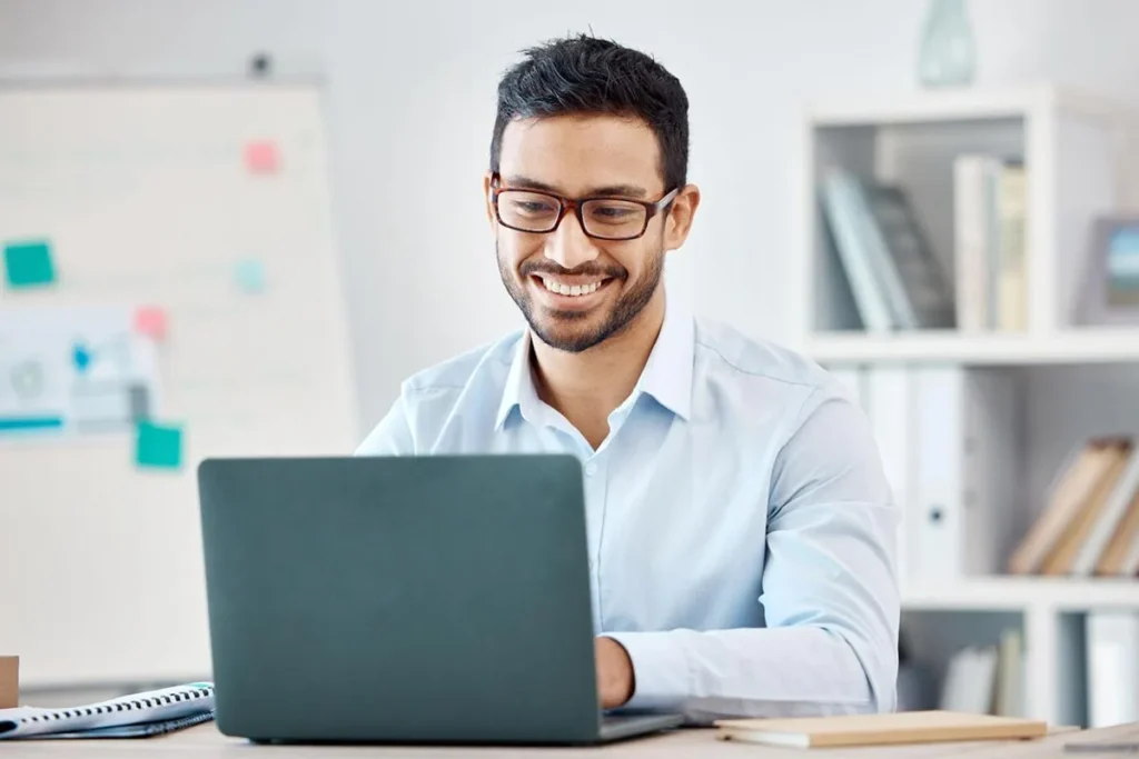 An advertising and marketing professional using laptop