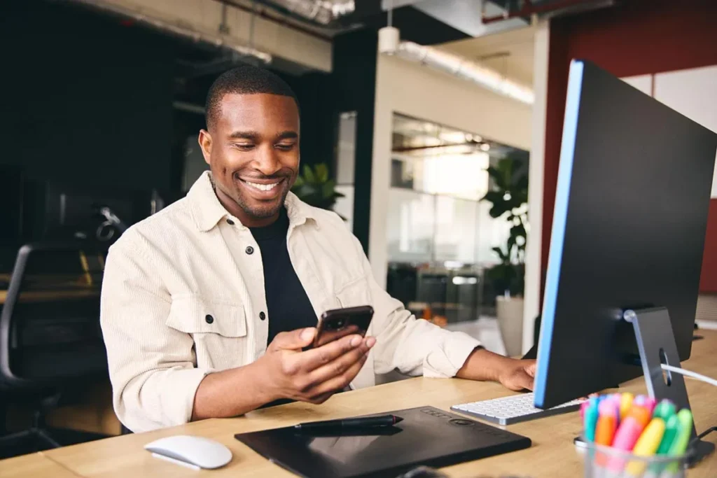 Man using phone to check online reviews for local businesses