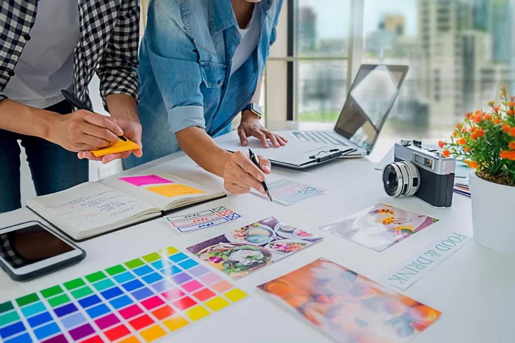 Creative ways to get your business noticed: marketing team engaged in brainstorming session, surrounded by colorful sticky notes