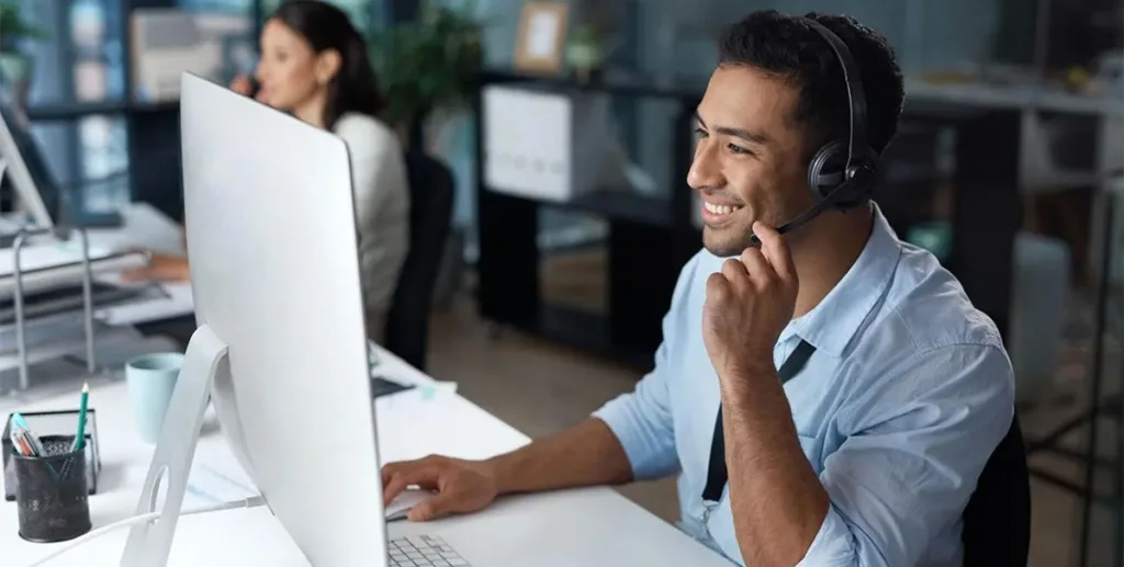 Sales manager working in office using a laptop