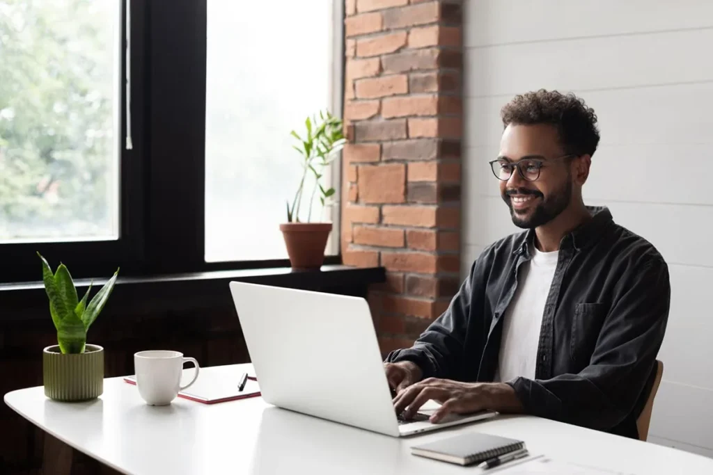 Marketing manager using laptop in office