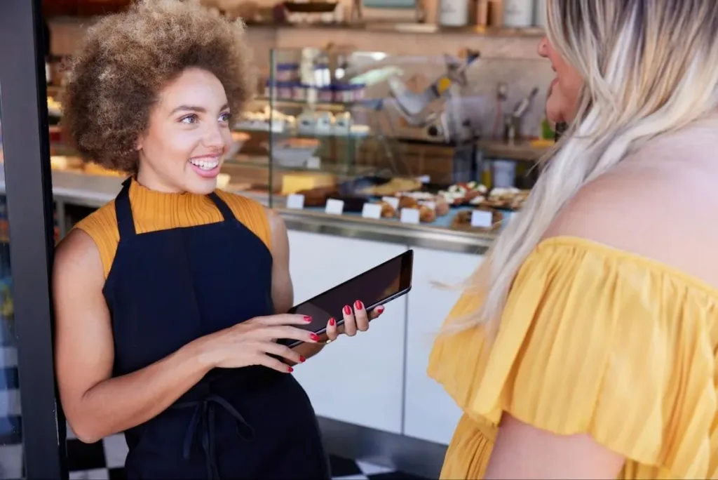 Waiter talking to a customer