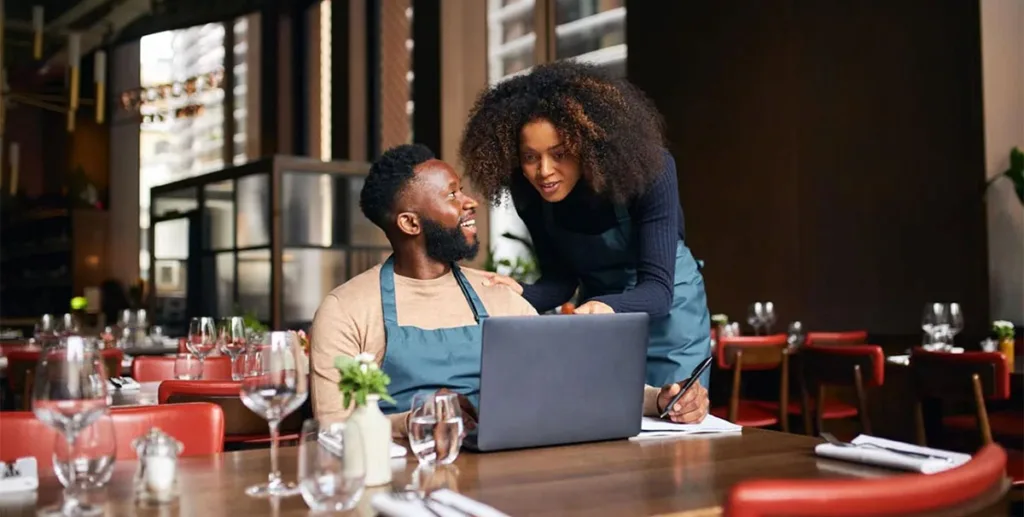 Small business digital ready: restaurant owners using laptop