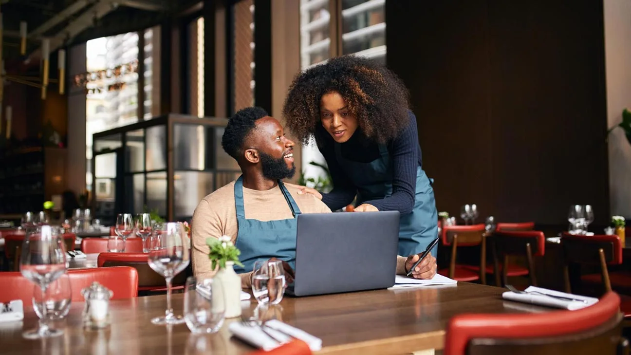 Small business digital ready: restaurant owners using laptop