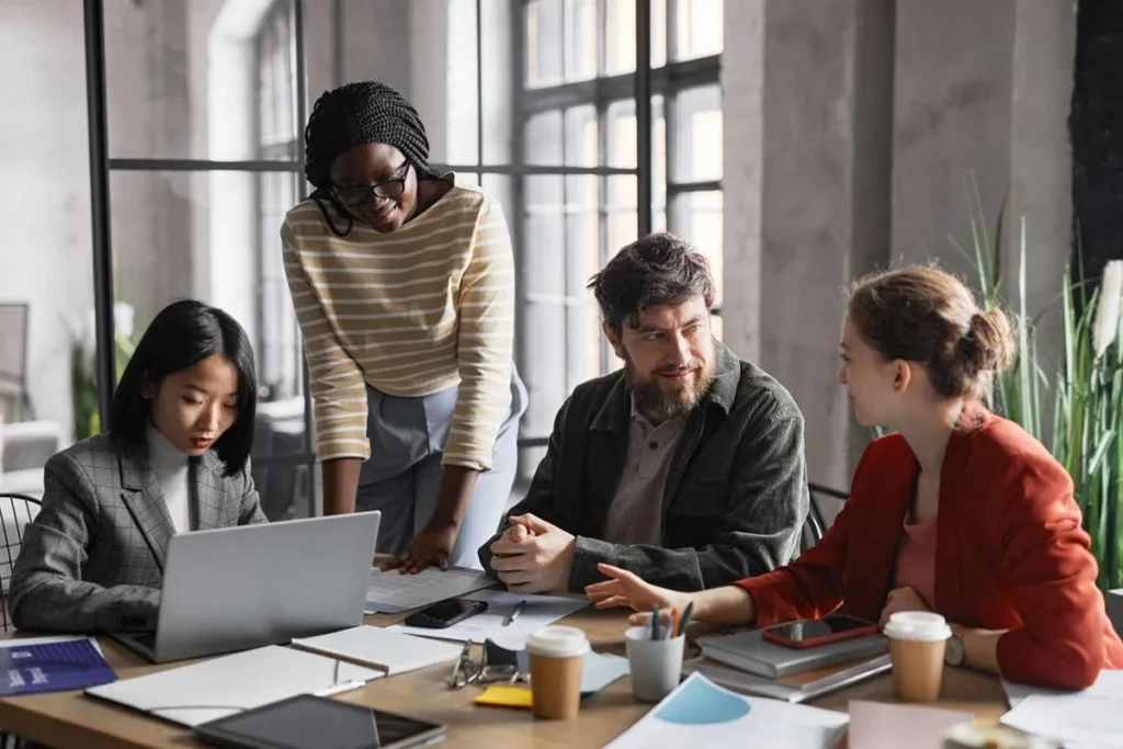 Human Resources executives having a team meeting around conference table