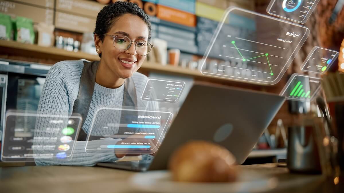 Coffee shop owner using her laptop