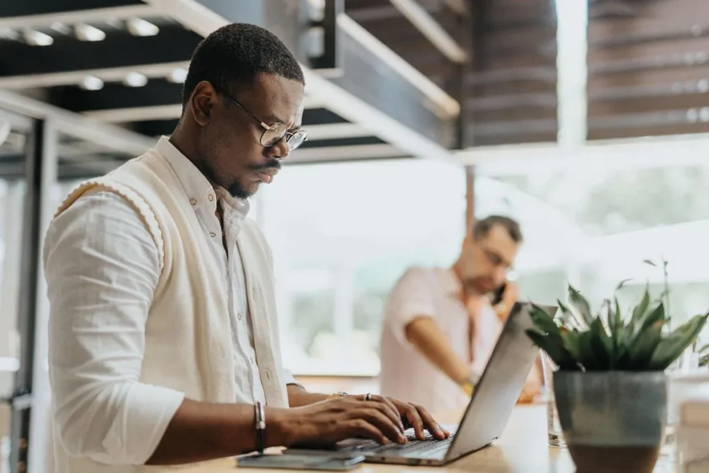 Marketing manager standing at his desk