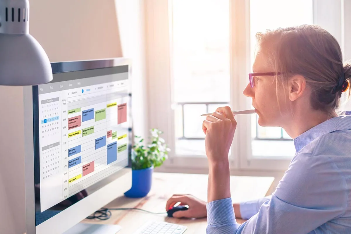 Business owner viewing a seasonal marketing calendar on a computer screen