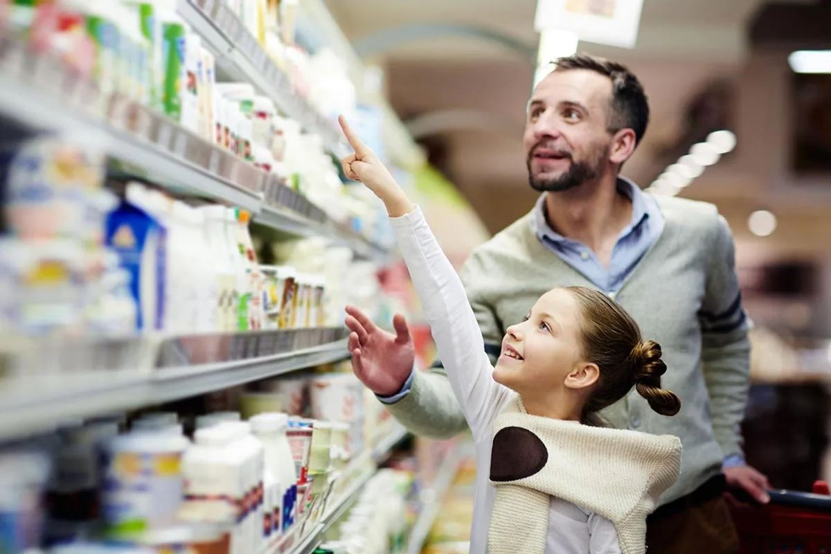 Father and daughter shopping in a supermarket