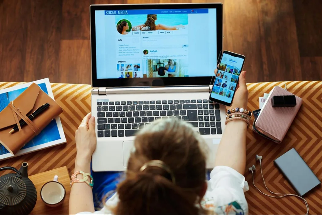 Small business owner setting up a social media account on a laptop