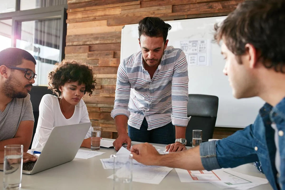 Advertising agency managers collaborating during a team meeting