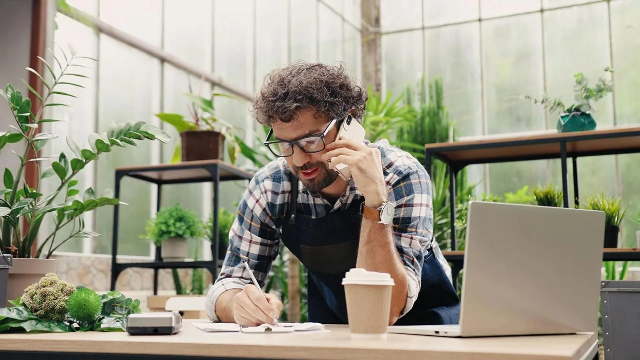 local business owner on phone