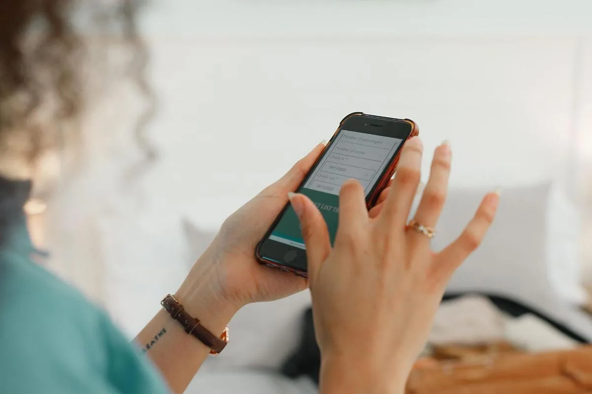 A woman completing a form pop-up on her smartphone