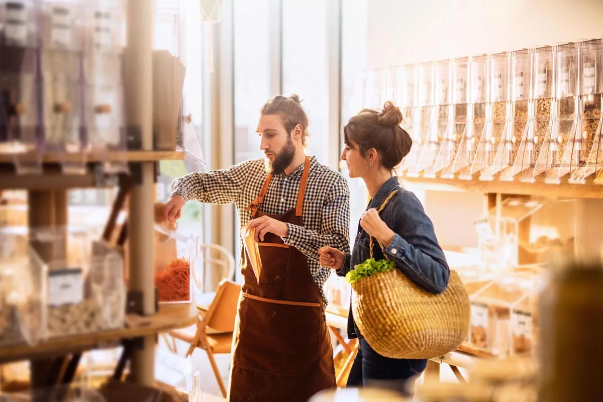 A local business owner assisting a customer inside the store