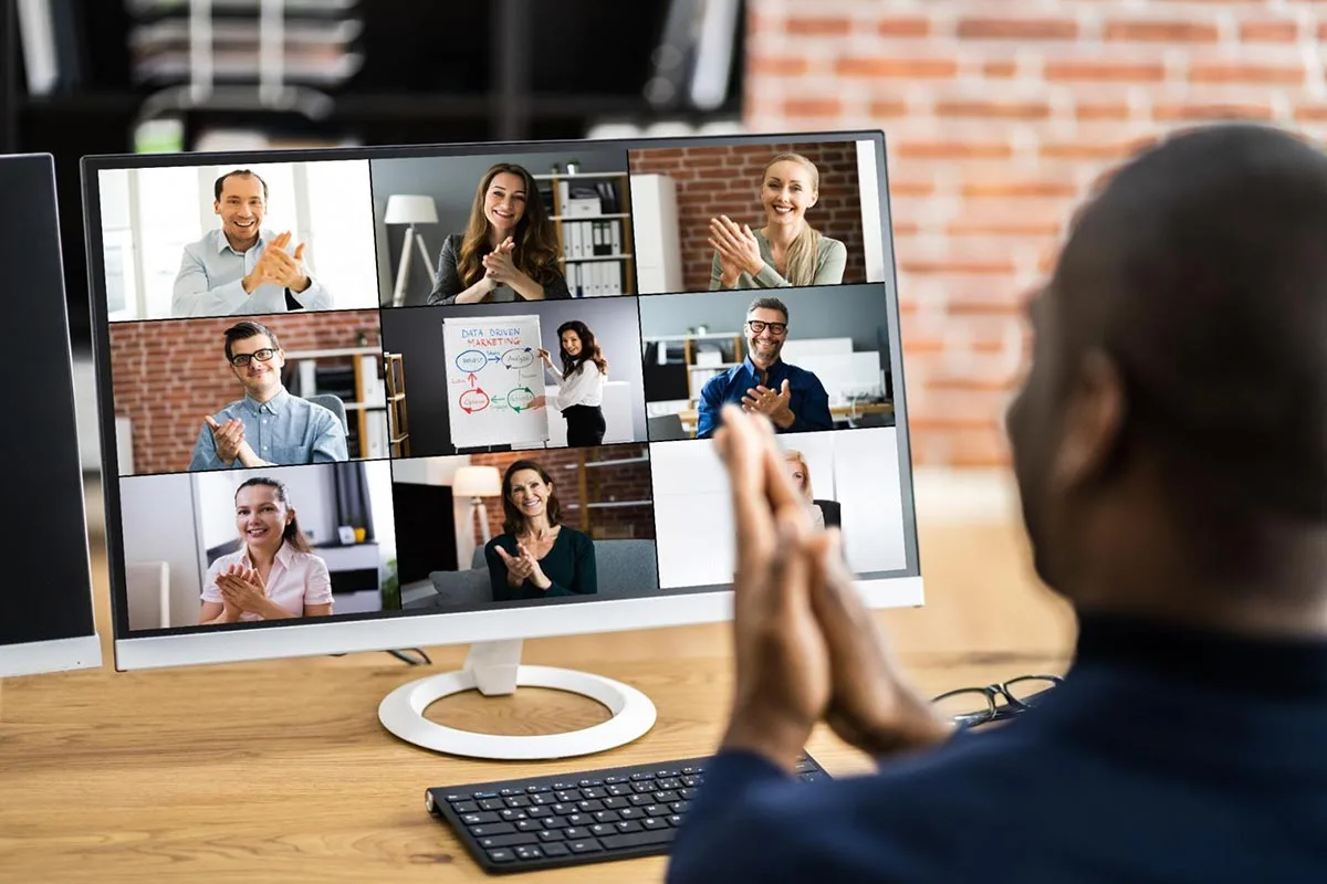 A marketing team engaged in a collaborative Zoom call, discussing strategies and projects