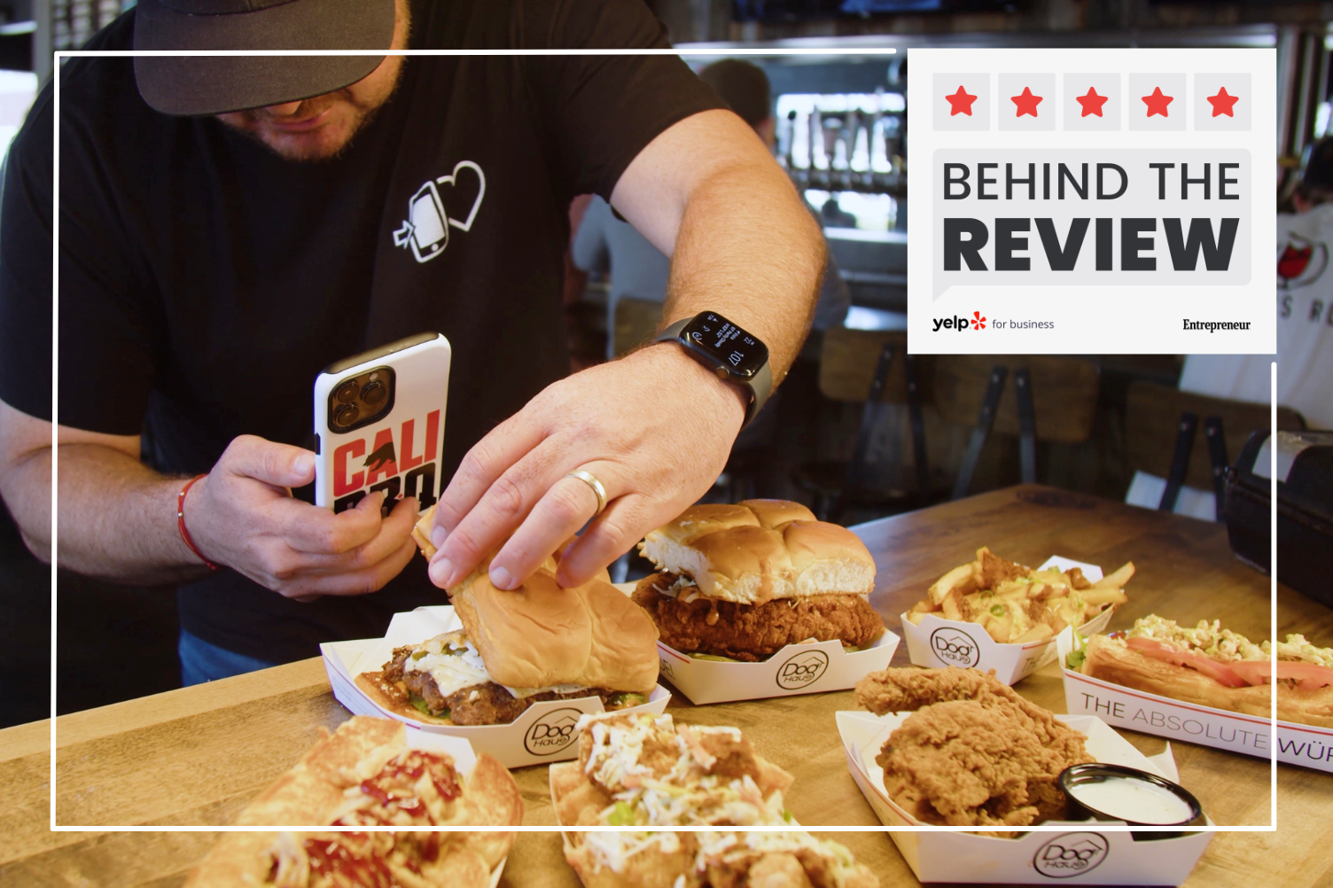 Photo of restaurateur and content creator Shawn Walchef taking photos of chicken sandwiches from Dog Haus from Cali BBQ Media