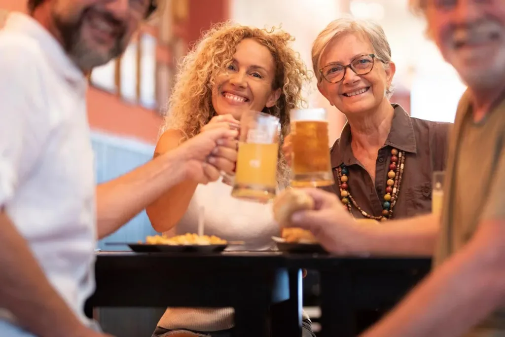 A family enjoying drinks together at a cozy restaurant setting.