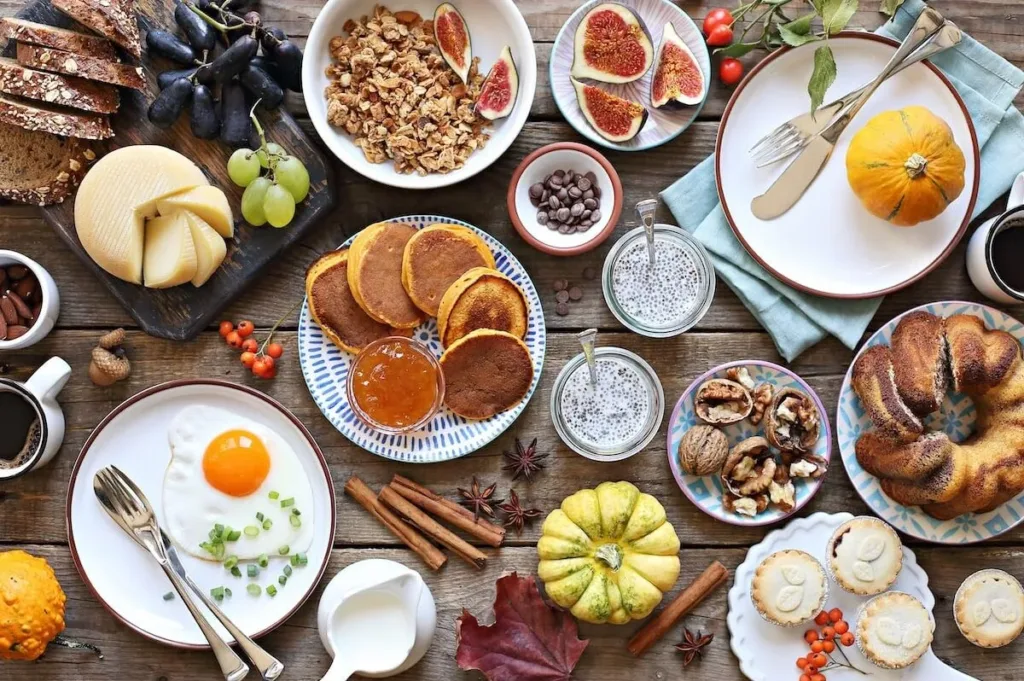 A table filled with family-style dishes at a restaurant.