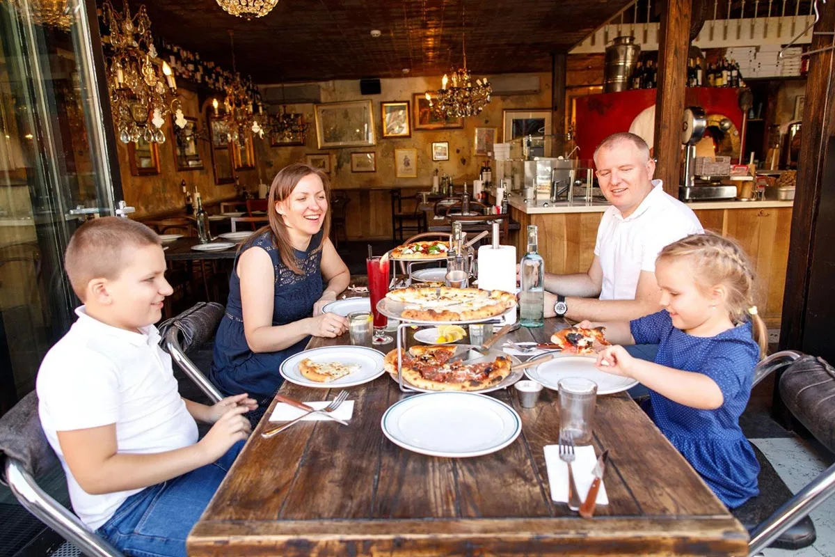 A family enjoying a Father's Day meal together at a restaurant.