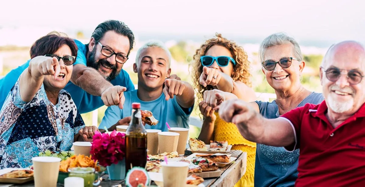 Happy family dining together at a restaurant celebrating Father’s Day.