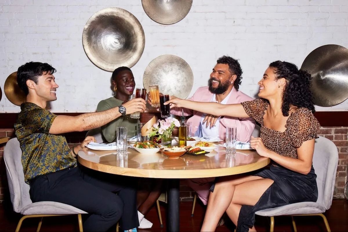 Group of friends clinking their glasses