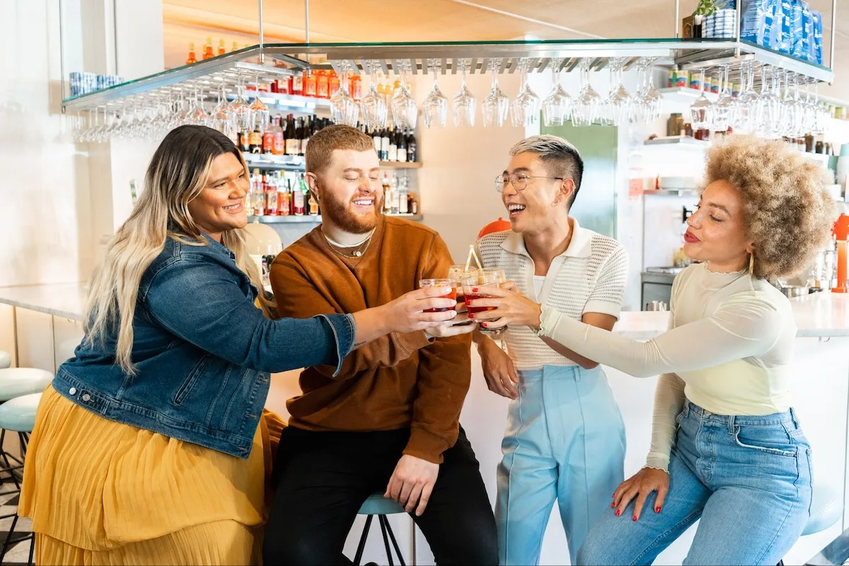 Group of friends clinking their glasses